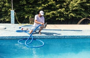 man providing commercial pool maintenance services