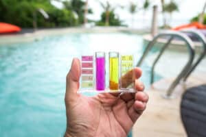 man testing water chemistry at a commercial pool